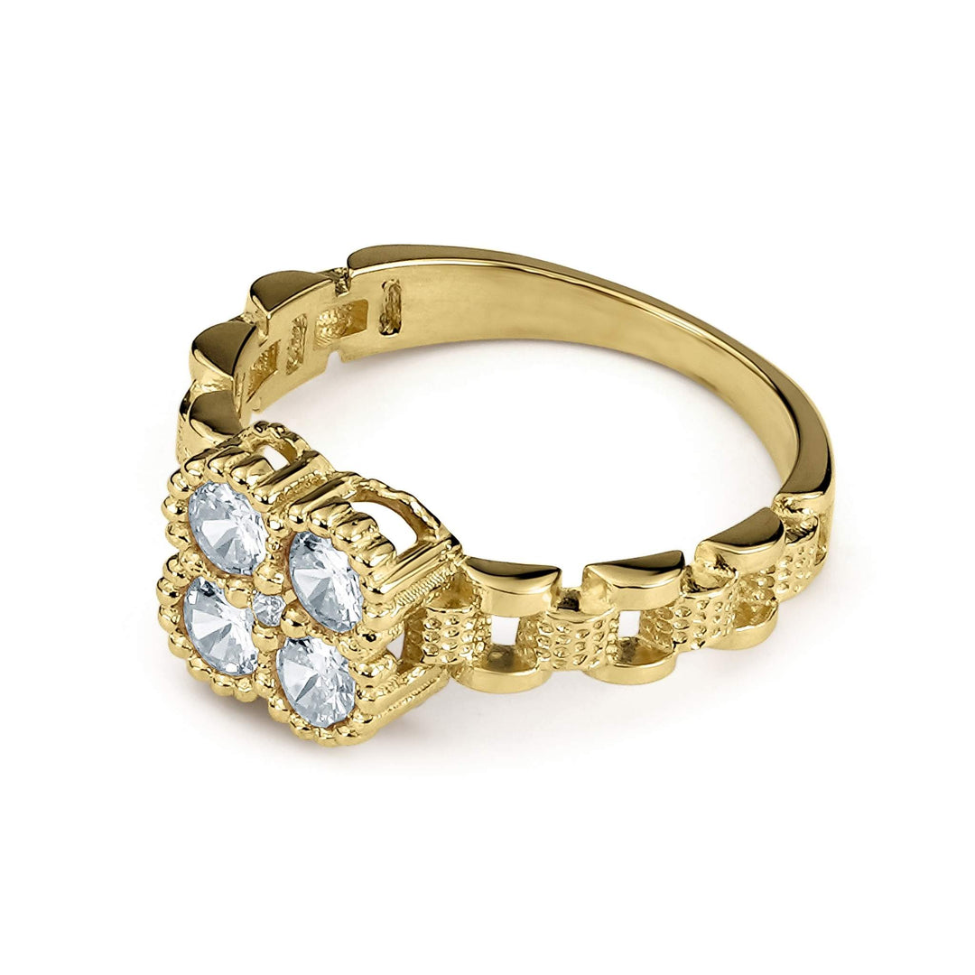 Gold clover-shaped ring with clear gemstones on a clean white background.