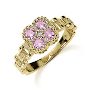 10k yellow gold Rolex-style band ring with a square pink gemstone flower cluster.