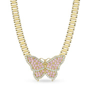 Gold butterfly pendant encrusted with pink and clear stones on a link chain.