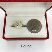 10k Gold ring with a cubic zirconia next to a U.S. quarter dollar coin for comparison 