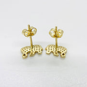 Reverse side of 10k gold elephant stud earrings with secure push-back closures.