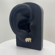 10k gold elephant stud earring with cubic zirconia on a black mannequin ear stand.