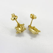 Reverse side of gold turtle stud earrings with secure push-back closures.