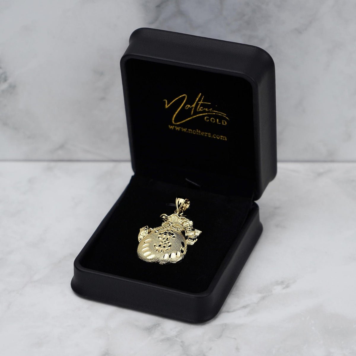10k gold money loot bag pendant displayed inside an open black jewelry box.