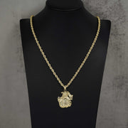 10k yellow gold money bag pendant necklace displayed on a black mannequin.