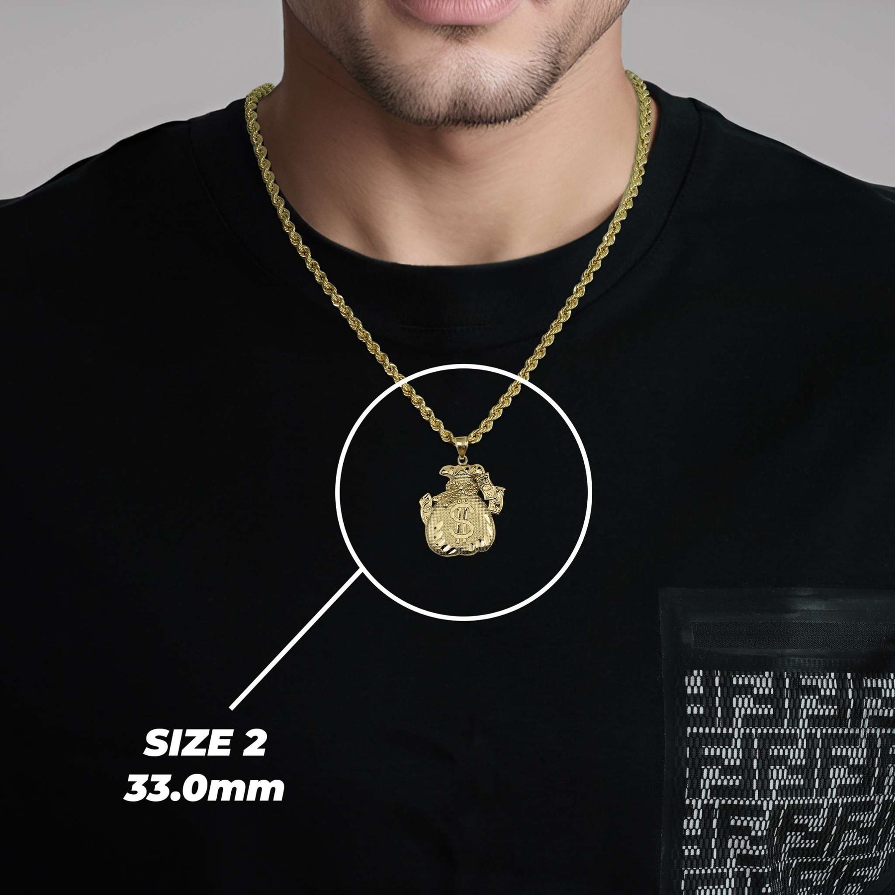 Man wearing a black t-shirt modeling a 33.0mm gold money bag pendant necklace.