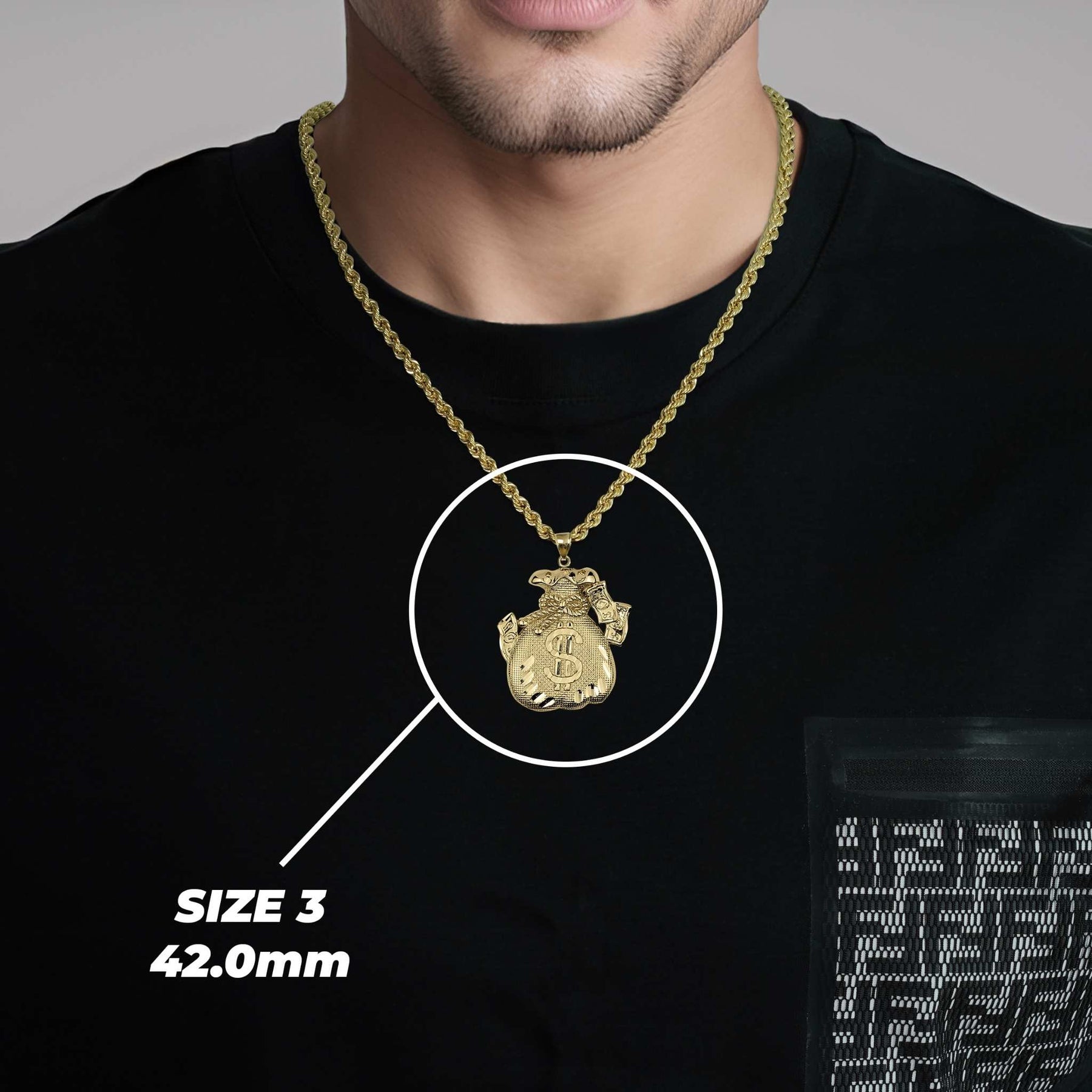 Man wearing a black t-shirt modeling a 42.0mm gold money bag pendant necklace.