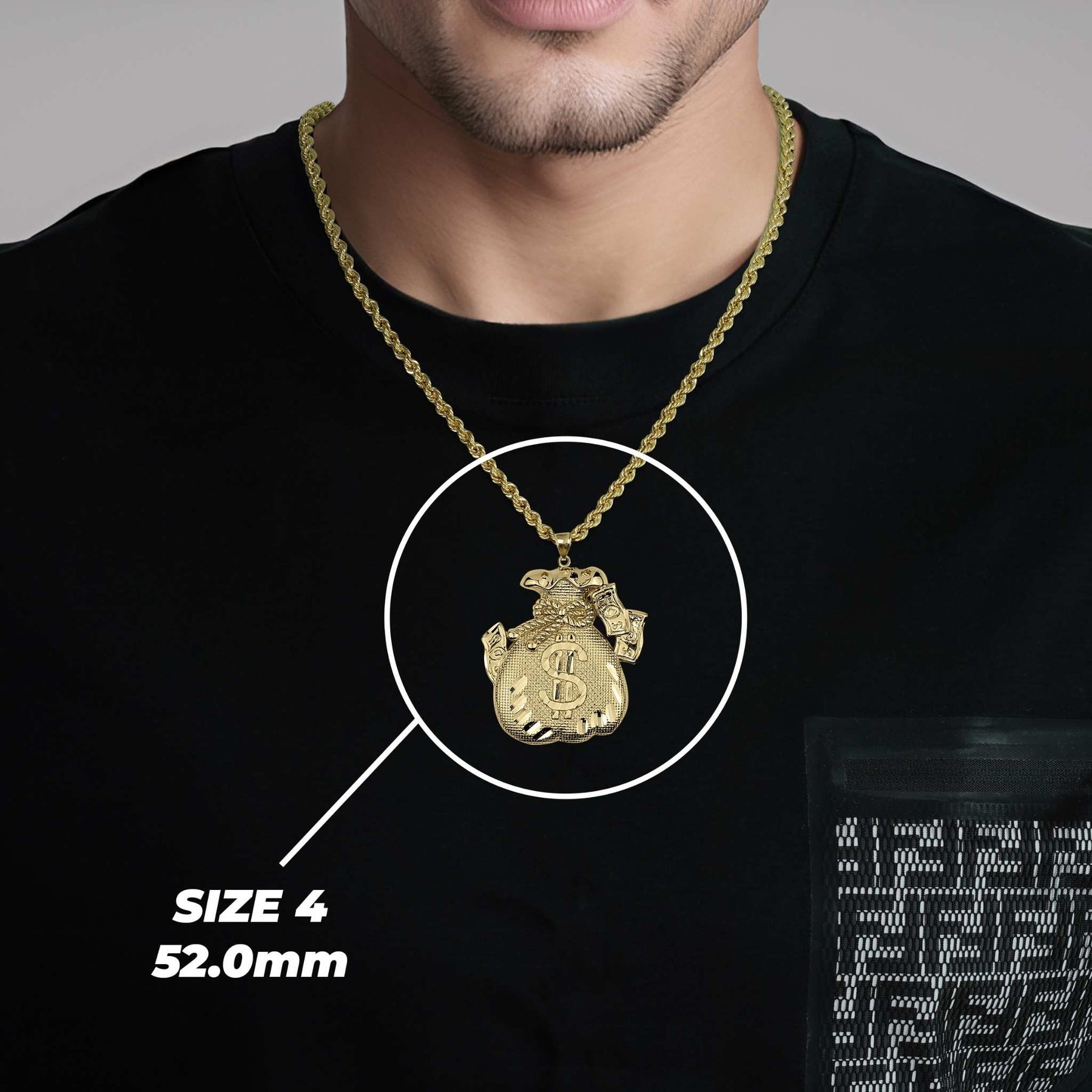 Man wearing a black t-shirt modeling a large 52.0mm gold money bag pendant necklace.