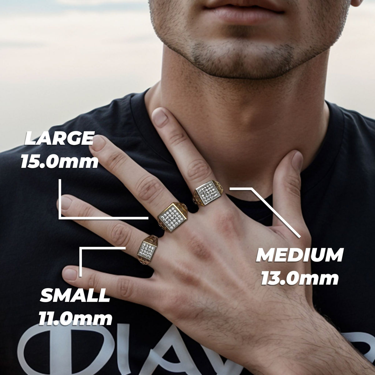 A person wearing small, medium, and large gold signet rings labeled with millimeter sizes.