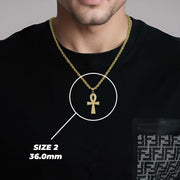 Man wearing a black shirt with a size 2 label highlighting the ankh pendant.
