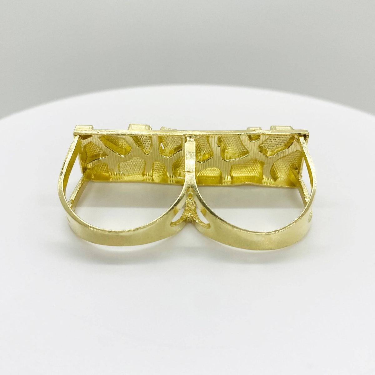 10k Gold nugget two finger ring with intricate design back view on a white background