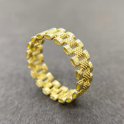 10k Gold Pattern Rollie Eternity Band ring front view on a gray background