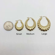 Size comparison of Small, Medium, and Large 10k yellow gold shrimp hoop earrings.