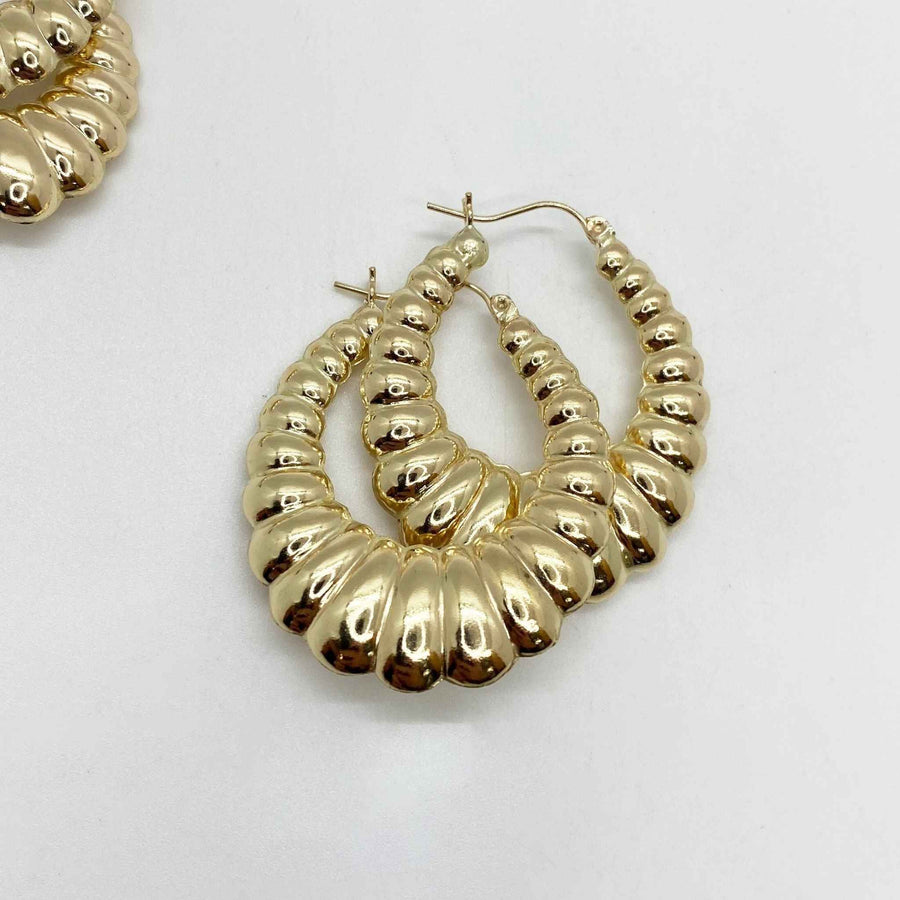 Pair of polished 10k yellow gold shrimp hoop earrings with a textured, ribbed design.