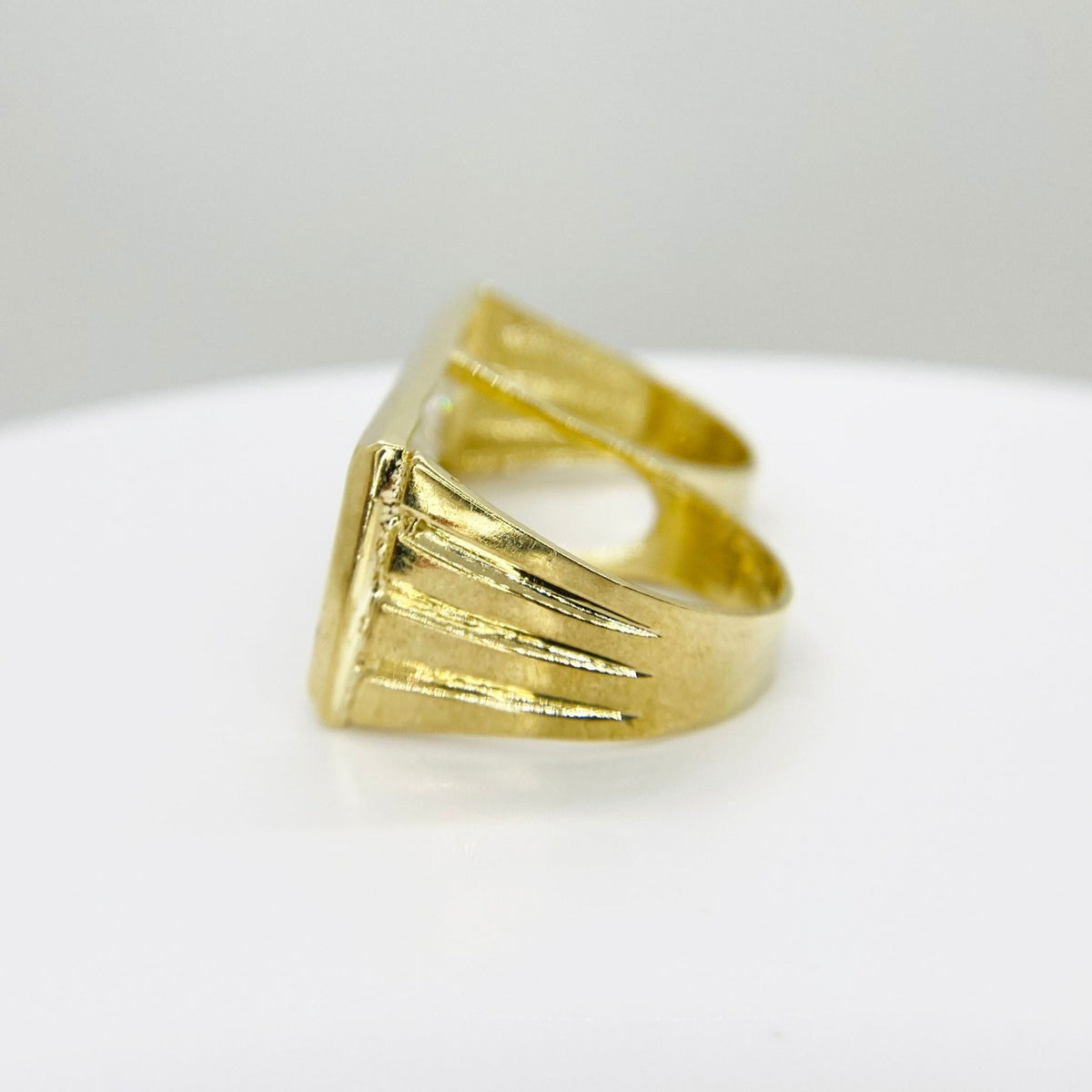 10k Gold two finger ring with a textured design side view on a white background