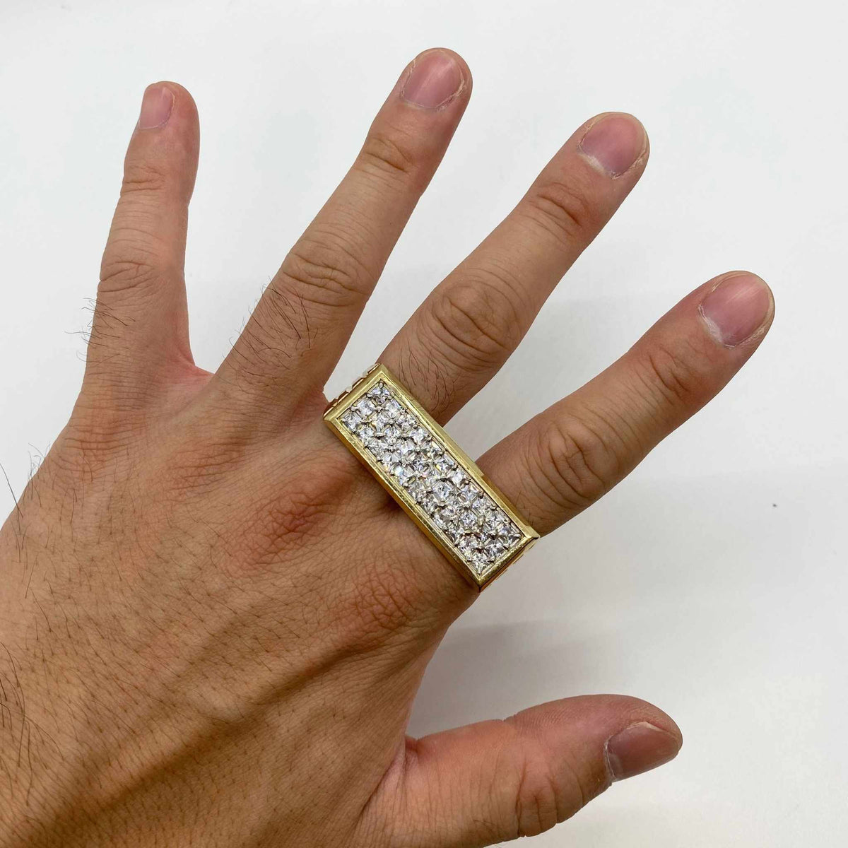 Hand wearing a 10k Princess Two Finger ring with Cubic Zirconia 
