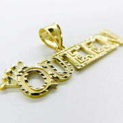 Close-up of 10k diamond-cut yellow gold "QUEEN" word pendant charm on a white background.