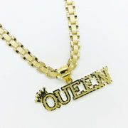 10k yellow gold diamond-cut "QUEEN" crown pendant on a thick Rollie link chain.