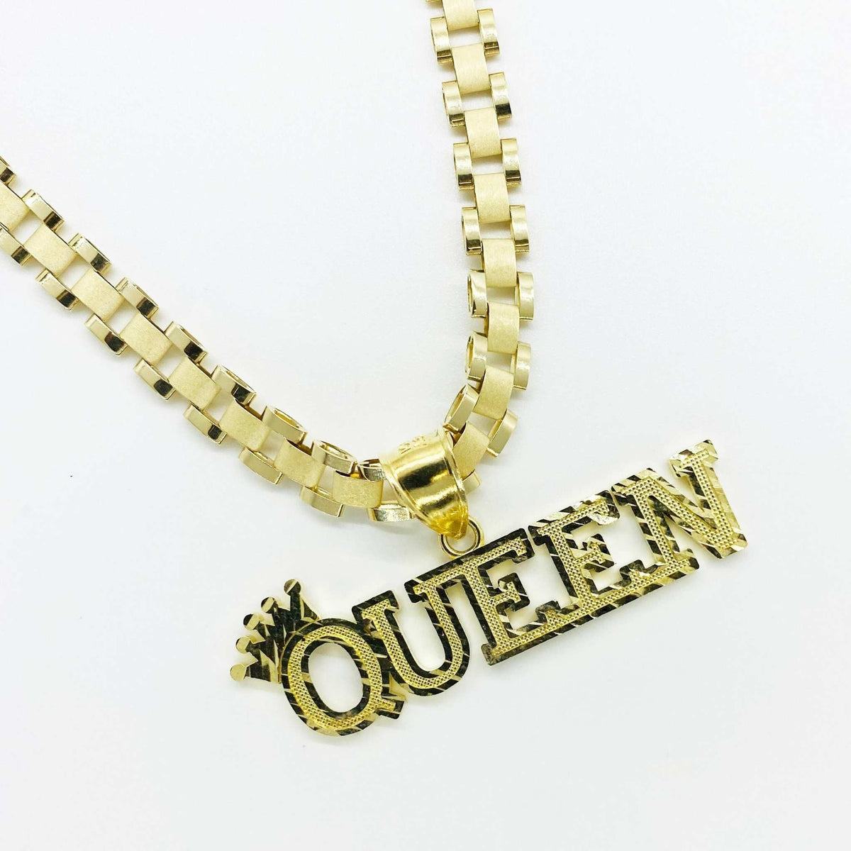 10k yellow gold diamond-cut "QUEEN" crown pendant on a thick Rollie link chain.