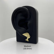 Medium 16.6mm 10k gold Queen Nefertiti stud earring on a black display stand.