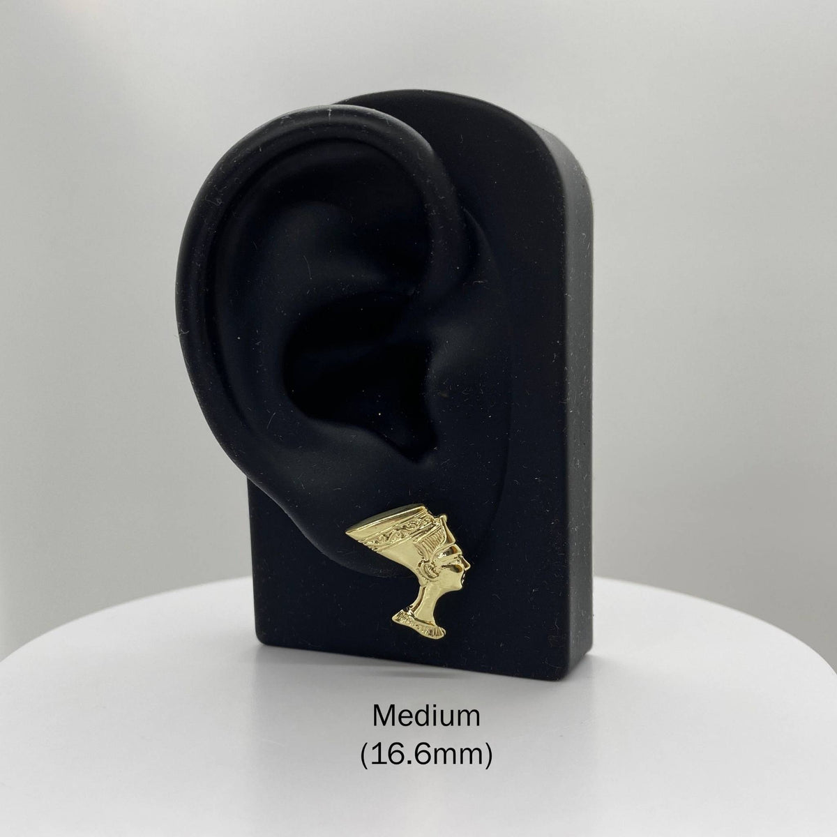 Medium 16.6mm 10k gold Queen Nefertiti stud earring on a black display stand.