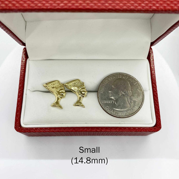 Small 14.8mm 10k gold Queen Nefertiti stud earrings next to a U.S. quarter for scale.