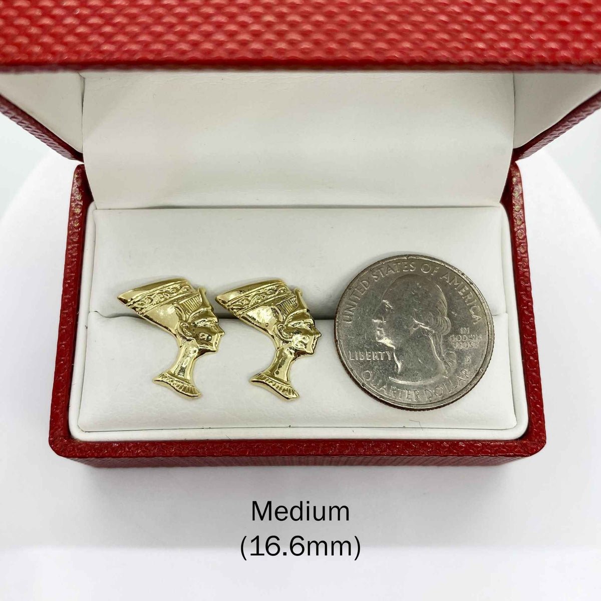 Medium 16.6mm 10k gold Queen Nefertiti stud earrings next to a U.S. quarter for scale.