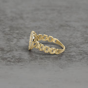 Side view of a 10k gold heart ring with a presidential link band.