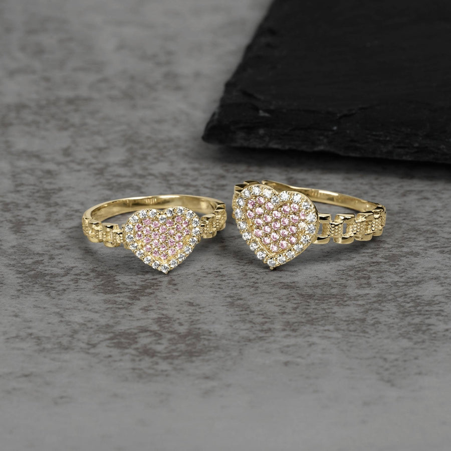 Two 10k gold heart-shaped rings with pink and white cubic zirconia stones.