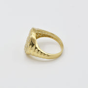 10k Gold Relic Money Sign ring side view on a light gray background