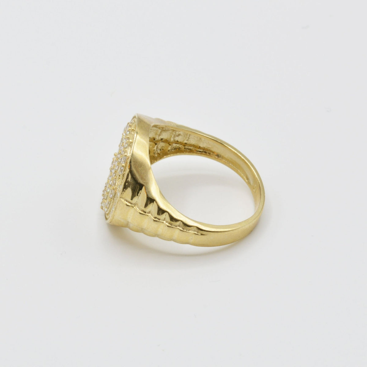 10k Gold Relic Money Sign ring side view on a light gray background