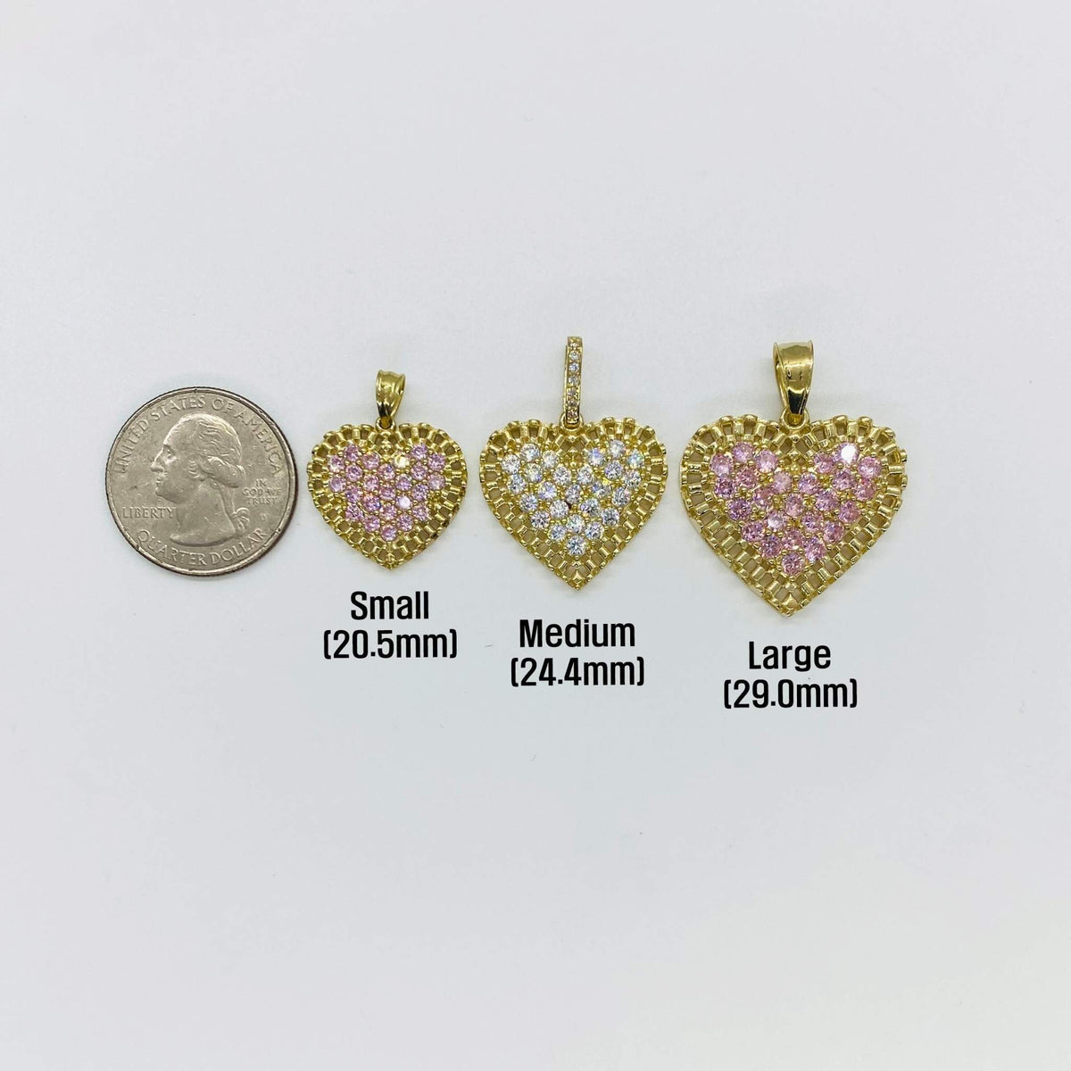 Size chart showing three gold heart pendants next to a quarter for scale.