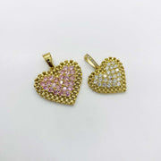 Two gold rollie-style heart pendants, one with pink stones and one with white stones.