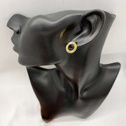 Textured 10k gold round stud earring on a black display mannequin.