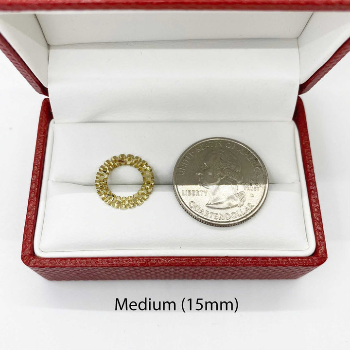 Medium 15mm 10k gold round stud earring next to a U.S. quarter for scale.