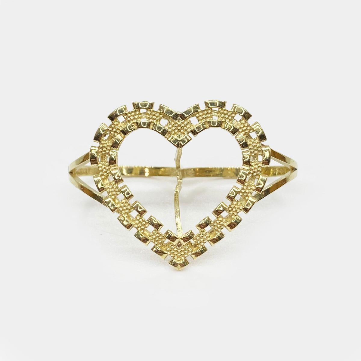 Front view of a 10k gold heart-shaped two-finger ring with watchband textured borders.