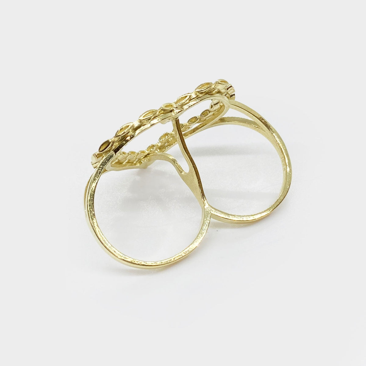 Back view of a 10k gold two-finger ring showing the dual bands and structure.