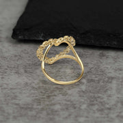 Back view of a 10k gold heart ring showing the smooth, polished inner band.