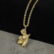 Polished 10k gold Pillsbury Doughboy pendant hanging on a rope chain, displayed on a bust.