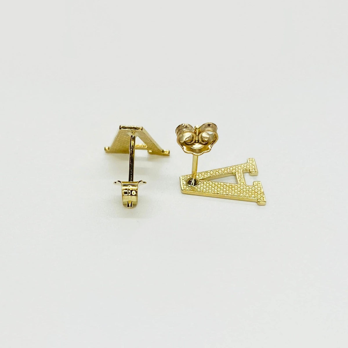 Rear view of gold initial letter 'A' stud earrings with secure push-back closures.