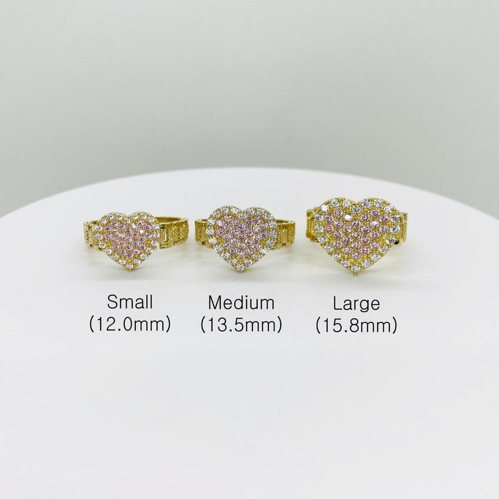Three pink sparkle heart-shaped rings in small, medium, and large sizes 