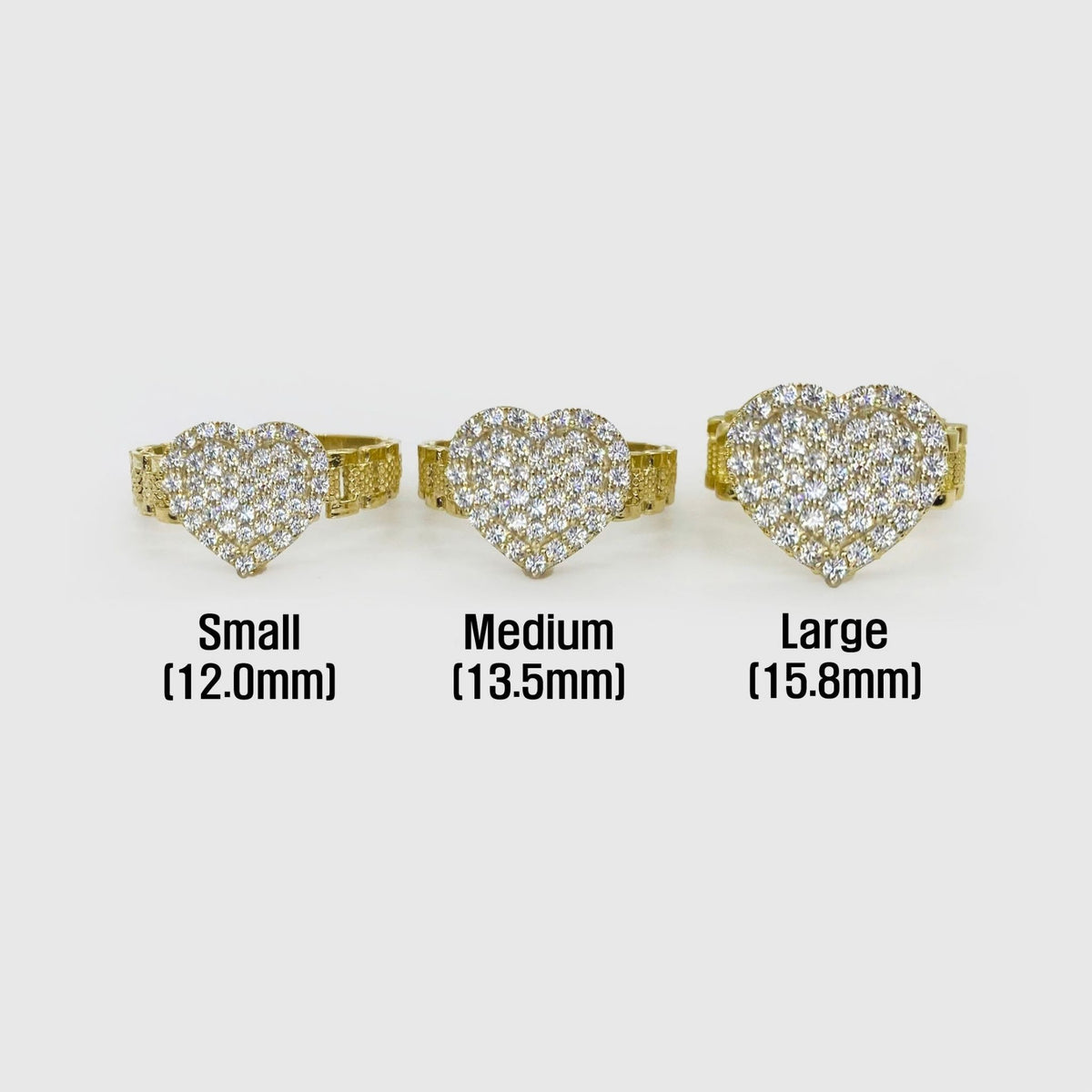 Three 10k gold Sparkle heart-shaped rings with size labels 