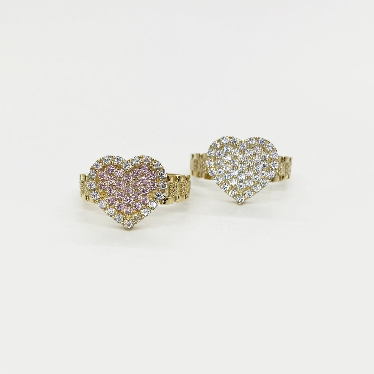 10k gold Sparkle Heart shaped rings with Cubic Zirconia on a white background
