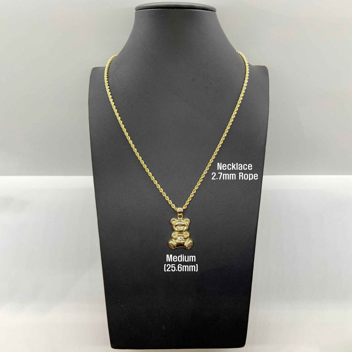 Medium 25.6mm 10k gold teddy bear pendant necklace on a black mannequin bust.