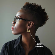 Side profile of a model wearing the 28.0mm Size 1 gold twisted square hoop.