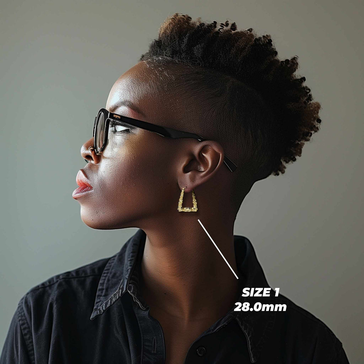 Side profile of a model wearing the 28.0mm Size 1 gold twisted square hoop.