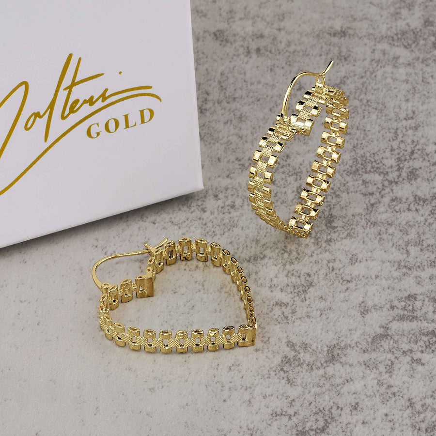 Pair of 10k yellow gold heart-shaped rollie hoop earrings resting beside a Nolters jewelry box.