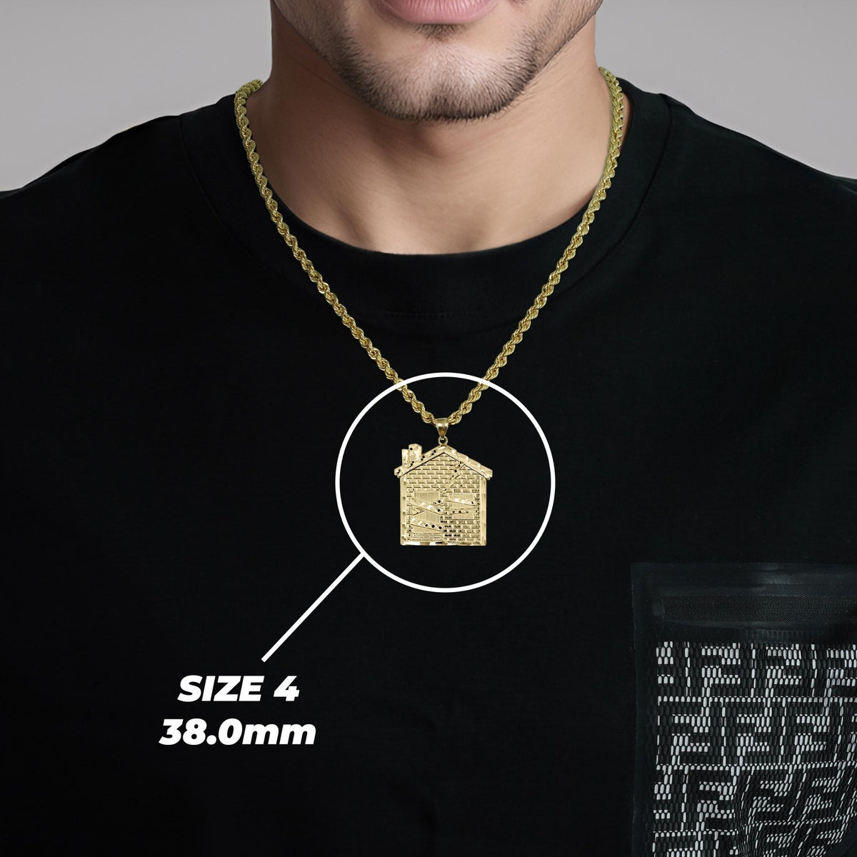 Model wearing a gold trap house pendant with Size 4 38.0mm label.