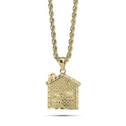 0k yellow gold trap house pendant hanging from a classic rope chain.