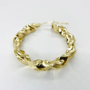 Single 10k yellow gold twisted hoop earring with a rope-like textured, spiral design.
